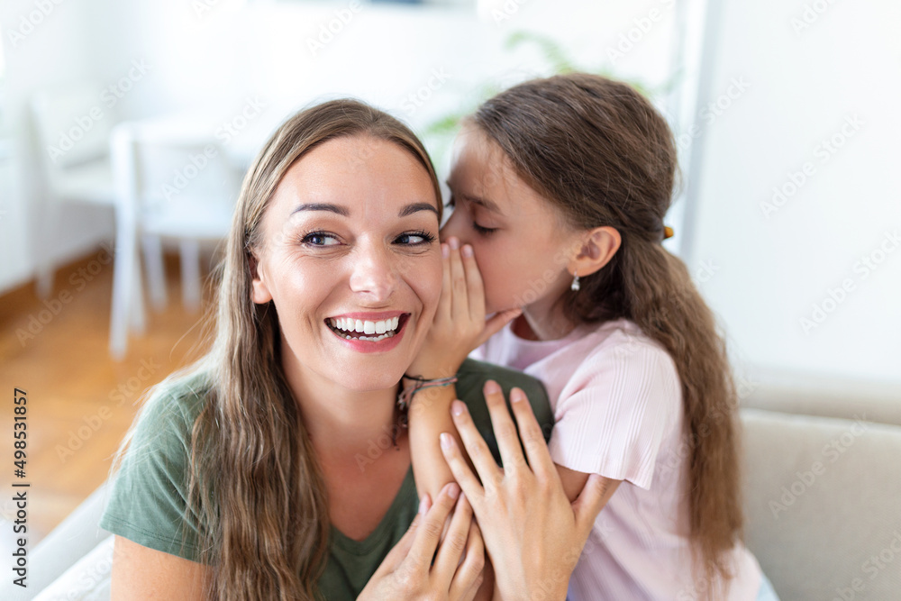 Close up image amazed mother hears incredible news from little daughter, kid girl share secret telling something interesting while mom open mouth feels surprised, trust, confidant person, fun concept Close up image amazed mother hears incredible news from little daughter, kid girl share secret telling something interesting while mom open mouth feels surprised, trust, confidant person, fun concept