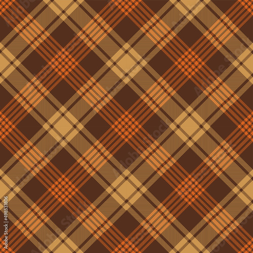 Brown and orange argyle tartan plaid. Scottish pattern fabric swatch close-up.  photo