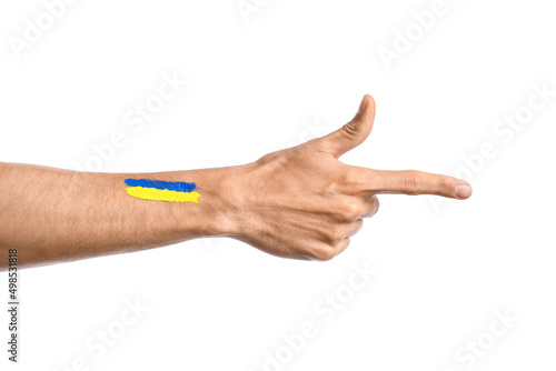 Male hand with painted Ukrainian flag showing something on white background