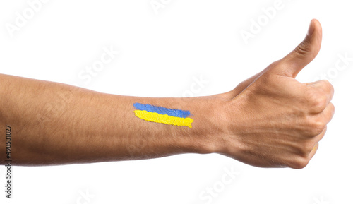 Male hand with painted Ukrainian flag showing thumb-up gesture on white background