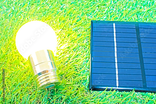 Wallpaper Mural grass and light bulb and solar panel Torontodigital.ca