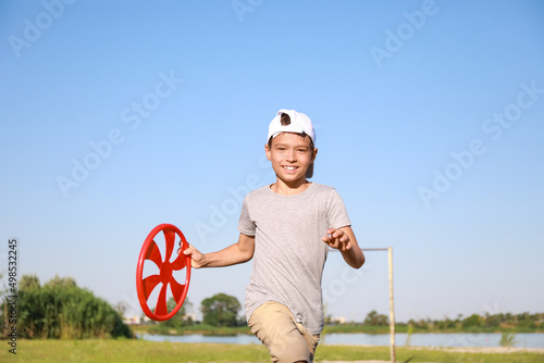 Cute little boy playing fri...