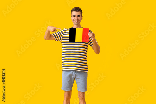 Young man with flag of Belg...