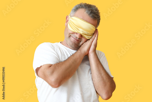 Mature man with sleep mask ...