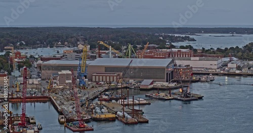 Portsmouth New Hampshire Aerial v17 fly around navel shipyard at kittery maine along piscataqua river with cranes, seavey island, barge and warehouse - Shot with Inspire 2, X7 camera - October 2021 photo