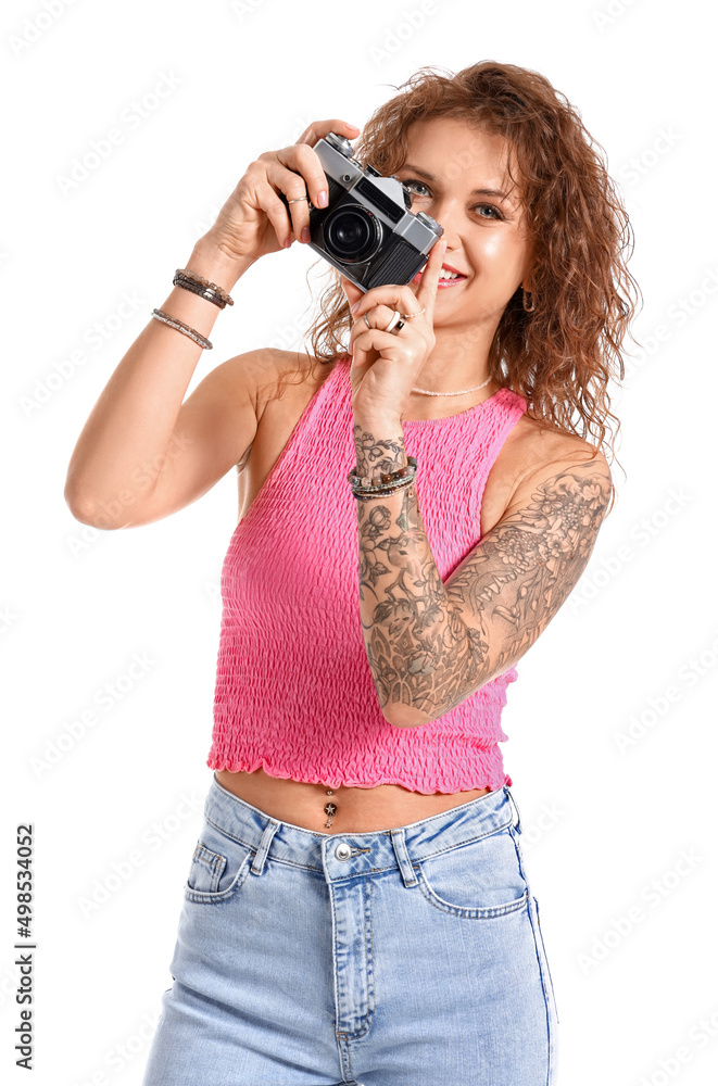 Beautiful tattooed woman with photo camera isolated on white Beautiful tattooed woman with photo camera isolated on white