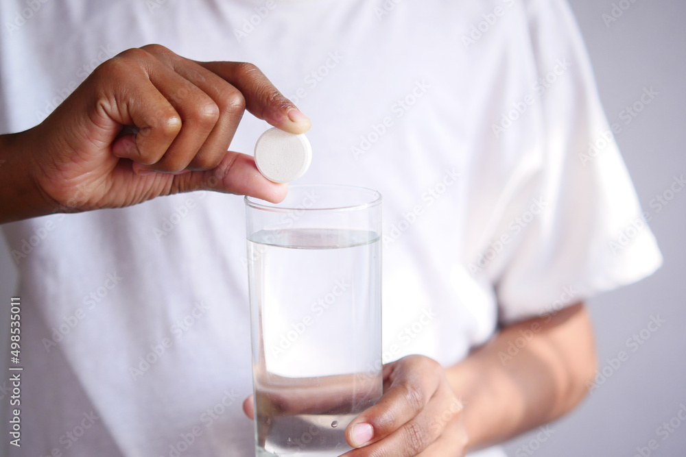 holding a Effervescent soluble tablet pills holding a Effervescent soluble tablet pills