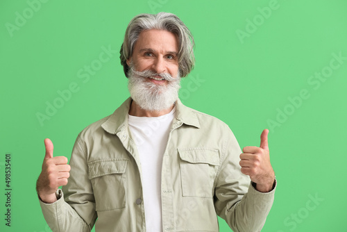 Bearded senior man in styli...