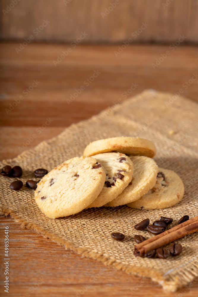 Coffee cookie on wooden table decorated with coffee beans Coffee cookie on wooden table decorated with coffee beans