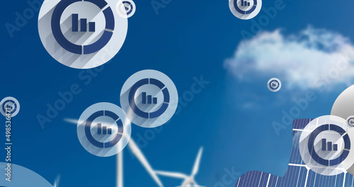 Image of floating icons with graphs over man with puzzle and wind turbines