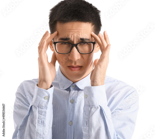 Young Asian man in eyeglasses worrying on white background