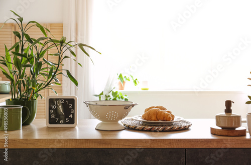 Wallpaper Mural Clock, colander and plate with croissants on counter in kitchen Torontodigital.ca