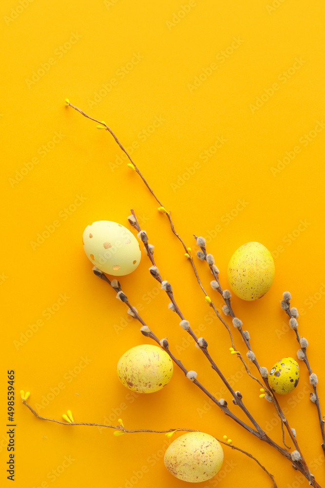 Fototapeta premium Composition with painted Easter eggs and pussy willow branches on color background