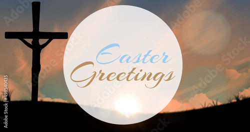 Image of easter greetings text over cross