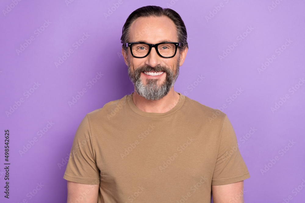 Photo of handsome good looking cheerful businessman in spectacles own his company isolated on violet color background Photo of handsome good looking cheerful businessman in spectacles own his company isolated on violet color background