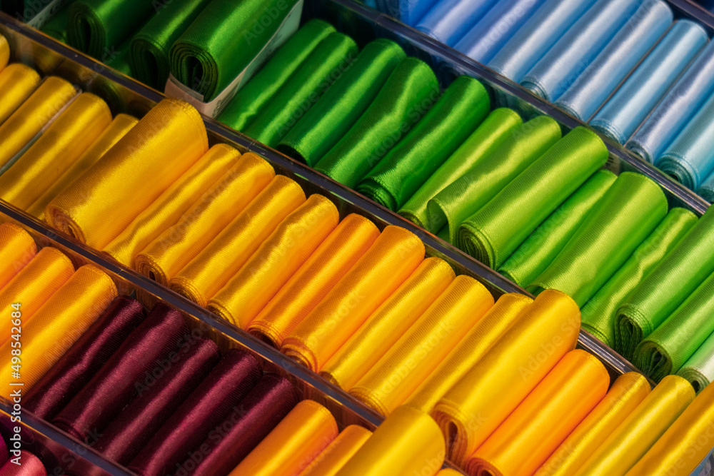 Multi colored fabrics sale of hobby goods. Bright handmade concept. Textile industry. Multi colored fabrics sale of hobby goods. Bright handmade concept. Textile industry.