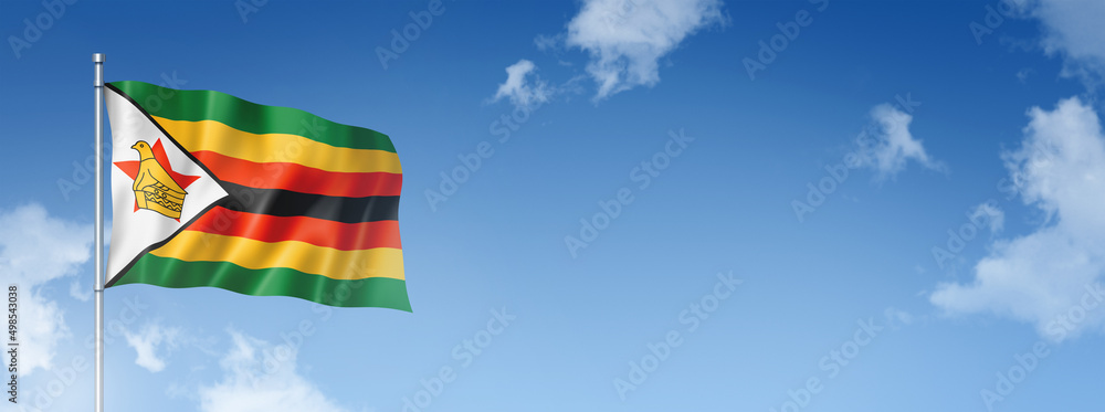 Zimbabwe flag isolated on a blue sky. Horizontal banner - obrazy, fototapety, plakaty 