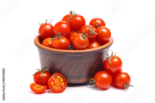 Group of cherry tomatoes in brown bowl isolated on white background. photo