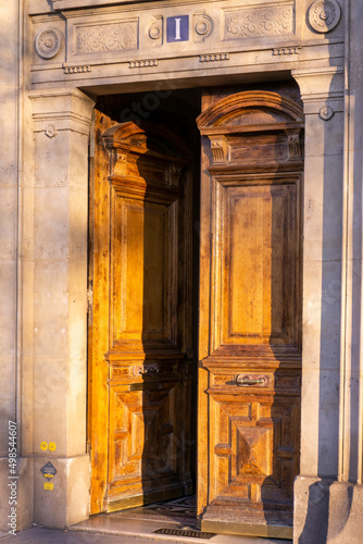 Ajar beautiful wooden door in a building