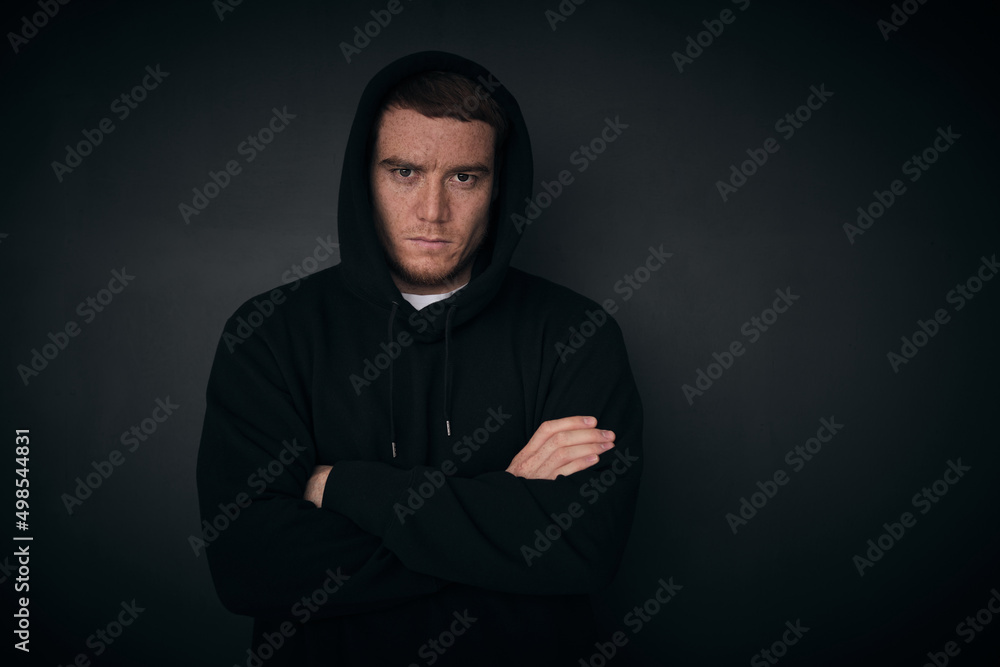 portrait of attractive middle aged men in a black hoodie. strong man portrait. Black-and-white photo.