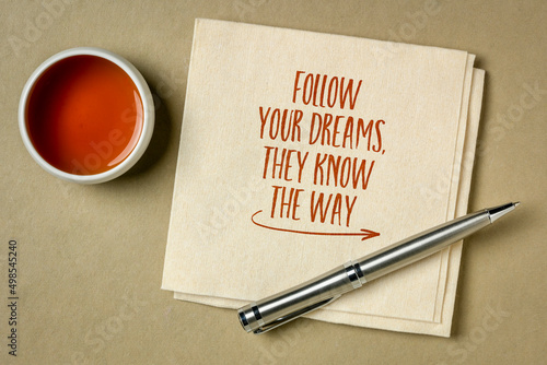 follow your dreams, they know the way - inspirational handwriting on a napkin, flat lay with tea, lifestyle and personal development concept