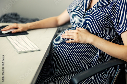 Canvastavla Home office and pregnant business woman wearing stripes dress, business housewife