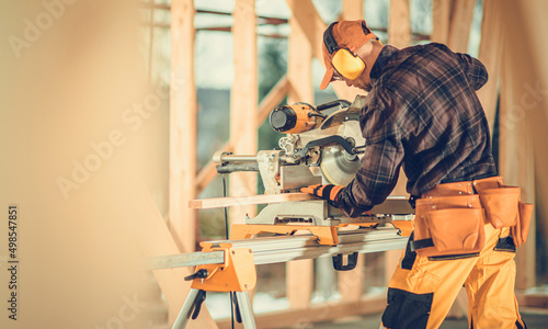 Construction Contractor Operating Large Wood Circular Saw © Tomasz Zajda