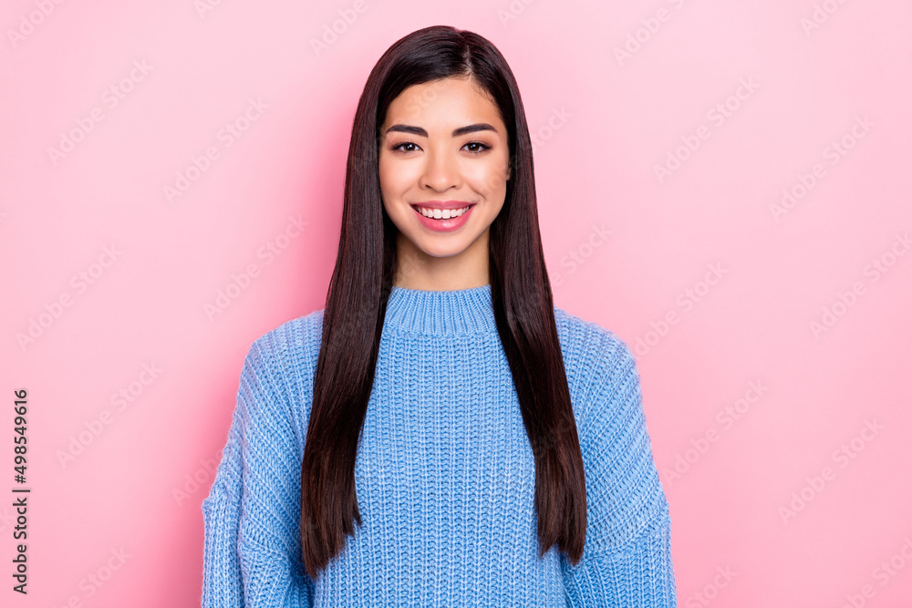 Portrait of attractive cheerful content brown-haired girl wearing blue pullover isolated over pink pastel color background Portrait of attractive cheerful content brown-haired girl wearing blue pullover isolated over pink pastel color background