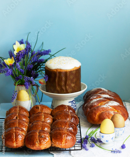 Traditional Easter pastries, cross buns, Easter cake and sweet challah and Easter eggs.