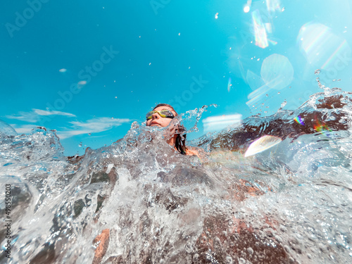 Girl splashed by the waves