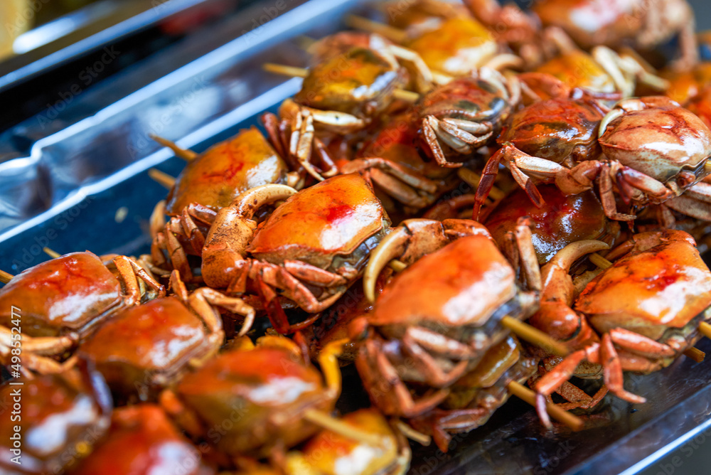 Beachside street food, fried small crabs and fried sea fish Beachside street food, fried small crabs and fried sea fish