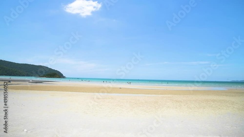 4K panning shot Background Footage of tropical asian beach, sea, sand and blue sky in summer day. Taken in Thailand which many of famous beach in Krabi, Phuket and Pattaya.