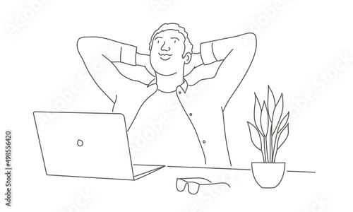 Young man immersed in dreams in the workplace.