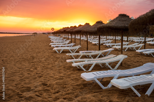 Beautiful colorful sunset on the beach in Vilamoura, Algarve, Portugal © malajscy