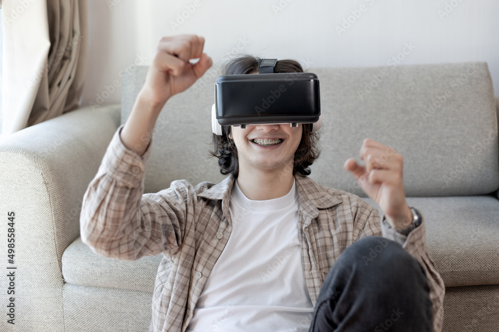 Man wearing virtual reality glasses is playing a 3D game with excitement, Man in glasses of virtual reality, VR, Future games, Gadgets, Technology, White background.., VR game concept. .. Man wearing virtual reality glasses is playing a 3D game with excitement, Man in glasses of virtual reality, VR, Future games, Gadgets, Technology, White background.., VR game concept. ..