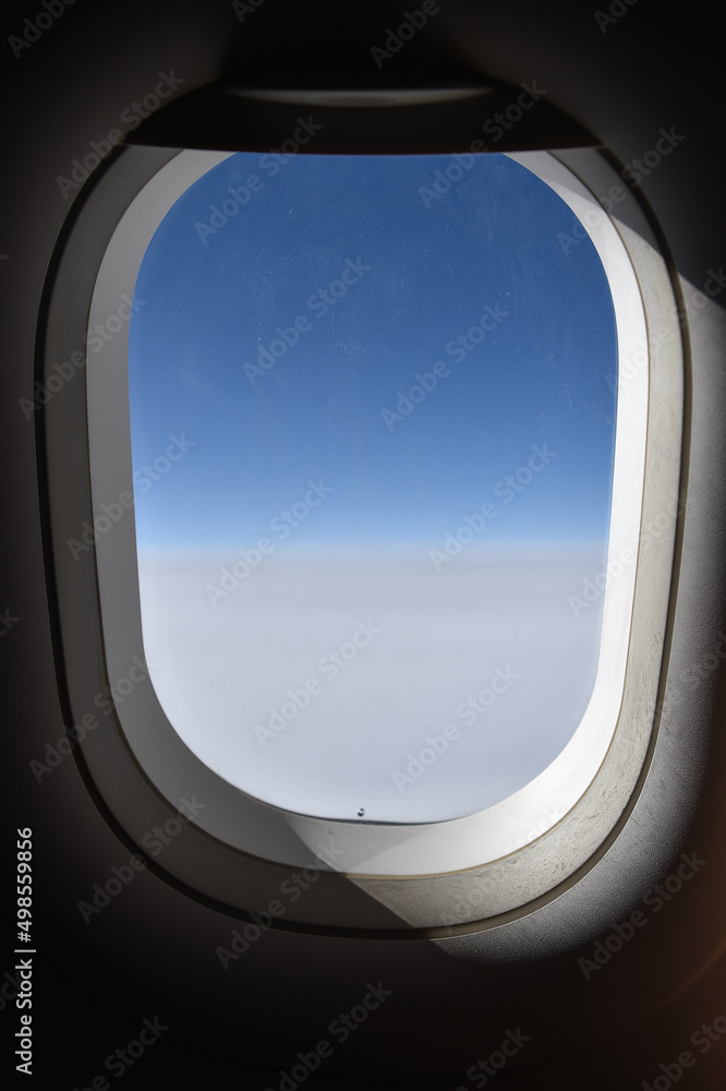 Clear blue sky seen during a flight from the plane's window Clear blue sky seen during a flight from the plane's window