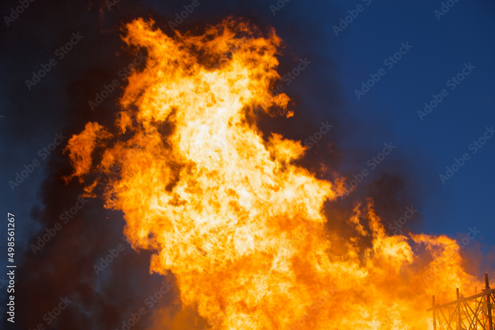 Raging flames of huge fire at night. Firestorm close up. Burning fire full frame. Bright inferno flames. Hell fire explosion. Blaze fire texture. Burning bright Bonfire. Intense combustion and heat. Raging flames of huge fire at night. Firestorm close up. Burning fire full frame. Bright inferno flames. Hell fire explosion. Blaze fire texture. Burning bright Bonfire. Intense combustion and heat.