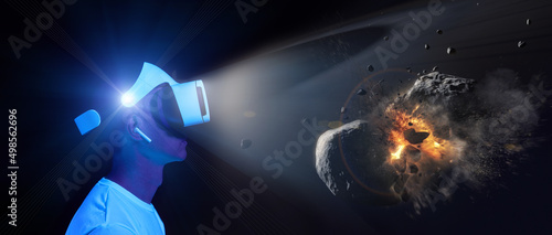 Fototapeta Naklejka Na Ścianę i Meble -  Man uses virtual reality headset to see the far corners of space. Elements of this image furnished by NASA.