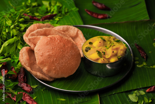 Obraz na plátně south indian famous breakfast poori or puri with potato curry served in a plate