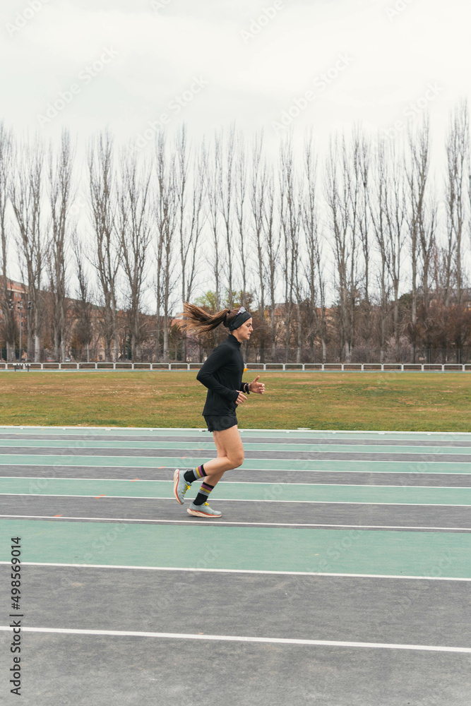 woman running on a running track