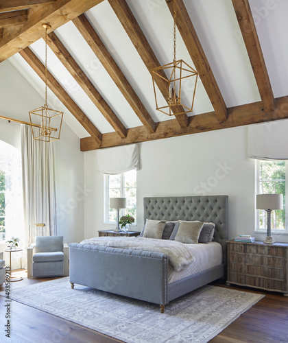 Bedroom with vaulted wood beam ceiling photo