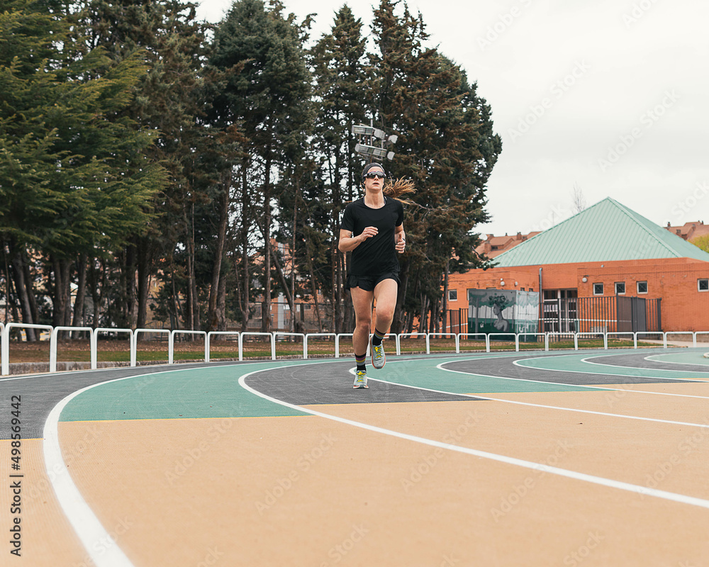 woman running on a running track