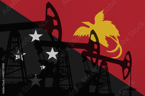 Pump- jacks on background in colors of national flag. Oil and gas wells production concept. Papua New Guinea