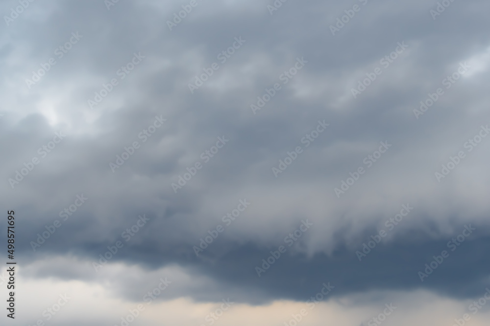 Structure of overcast sky as background. Clouds form texture. Approaching rain front, weather change