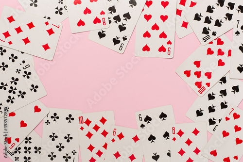 Playing cards on color background. Gambling concept. Top view