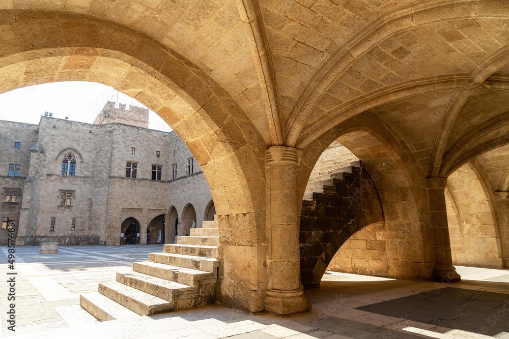 Arcades at the courtyard of Palace of the Grand Master of the Knights of Rhodes or Kastello. Medieval castle in the city of Rhodes, on island of Rhodes in Greece. Citadel of the Knights Hospitaller