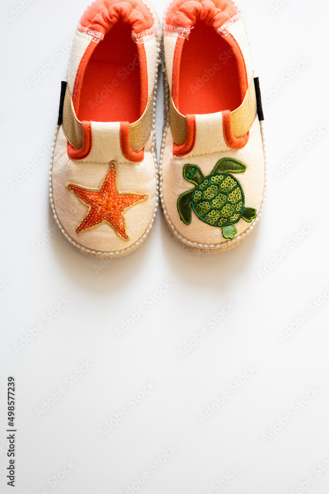 Children's house slippers on a white background. High quality photo