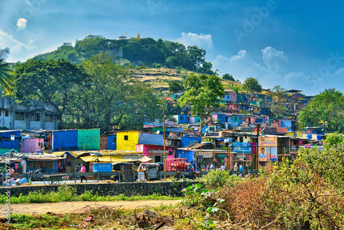 Canvas Print Shot of small old colorful houses built on green mountain in a town