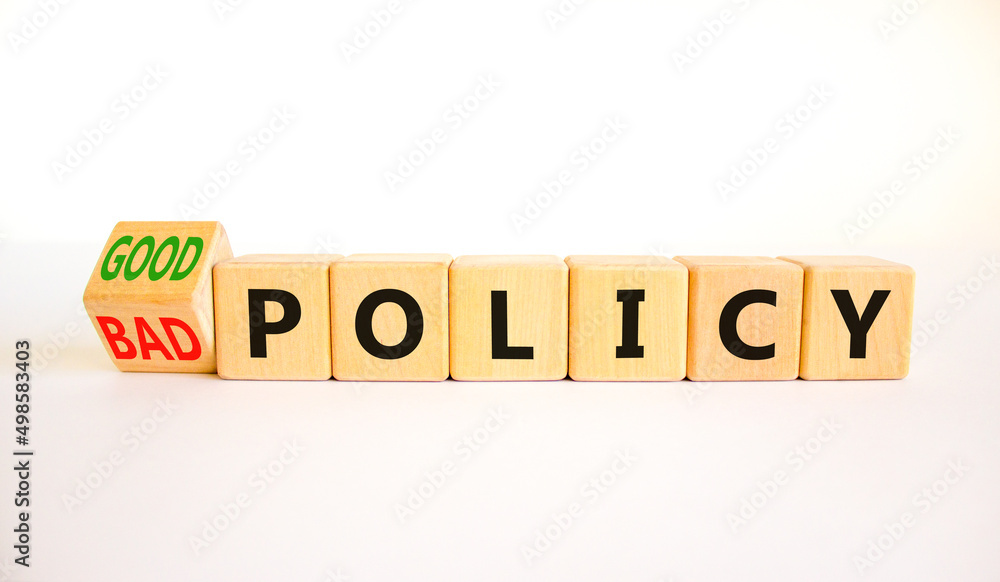 Good or bad policy symbol. Turned wooden cubes and changed concept words Bad policy to Good policy. Beautiful white table white background. Business bad or good policy concept. Copy space. Good or bad policy symbol. Turned wooden cubes and changed concept words Bad policy to Good policy. Beautiful white table white background. Business bad or good policy concept. Copy space.