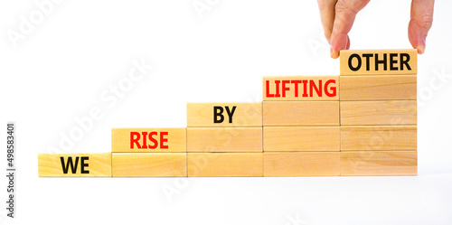 Фотография We rise by lifting other symbol